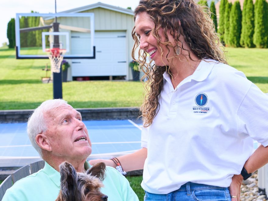 A Caregiver and her client sharing a moment outdoors