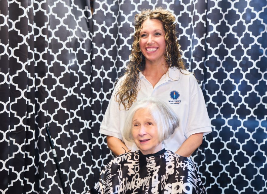 A Wayfinder Caregiver and her client together