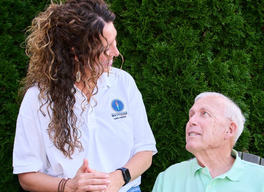 A Caregiver in conversation with her client outdoors
