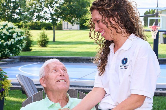 A Caregiver visiting a client in the garden